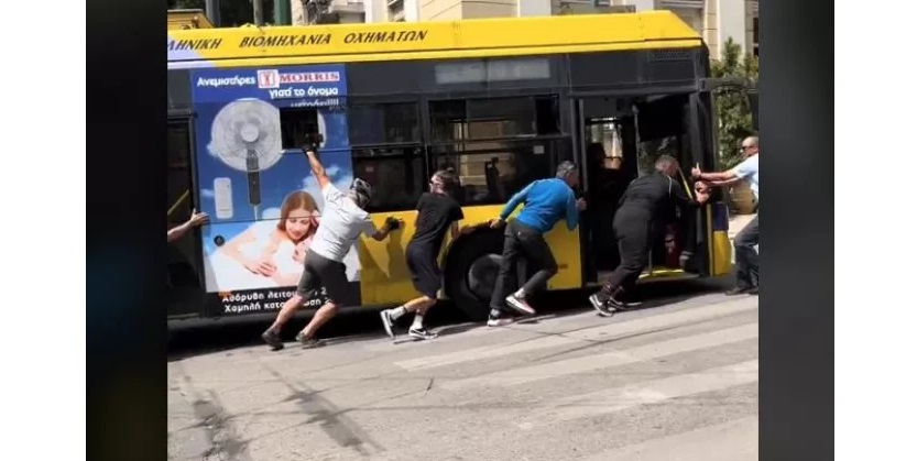 Passengers pushing broken-down trolley bus sparks social media mirth