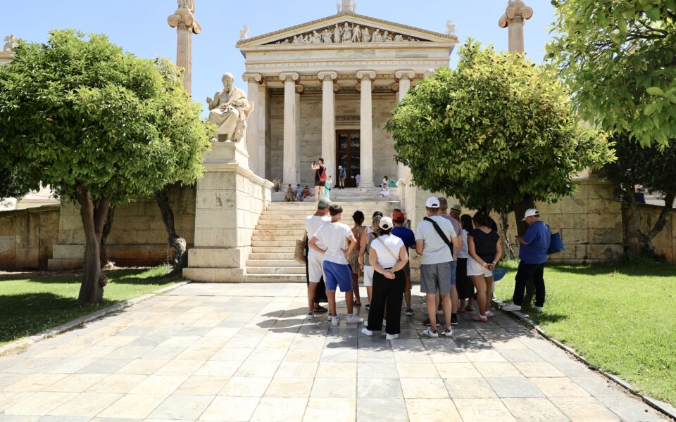 Tourists brave the heat on a quiet Athens day