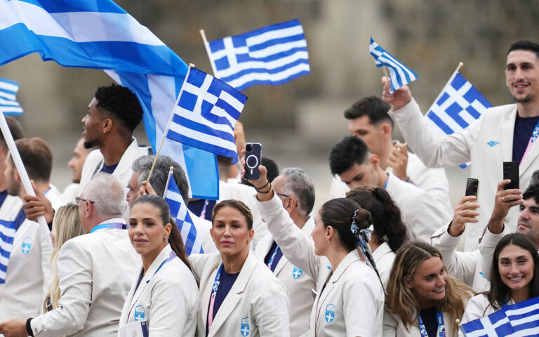 Greek team parades along Seine during Olympic games opening ceremony