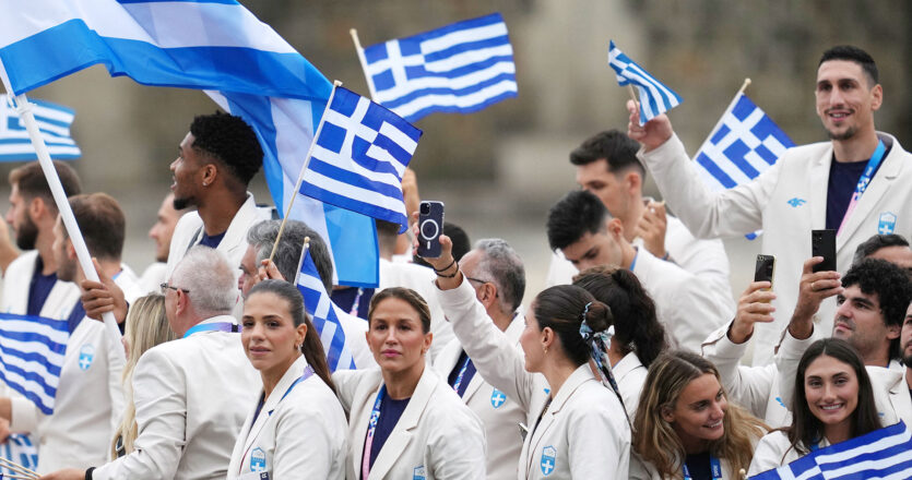 Greek team parades along Seine during Olympic games opening ceremony