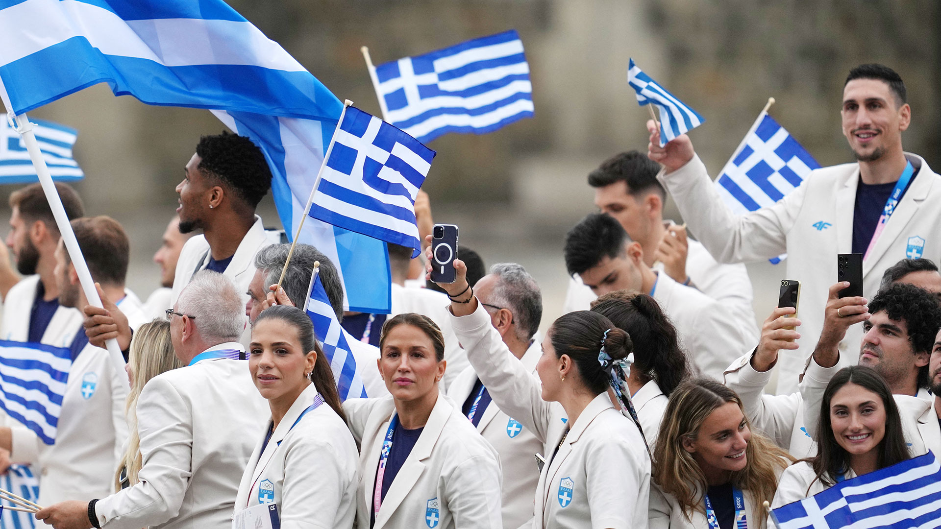 Greek team parades along Seine during Olympic games opening ceremony