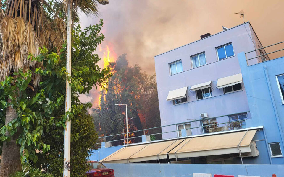 Greek authorities tame a wildfire that forced the evacuation of a hospital and a retirement home