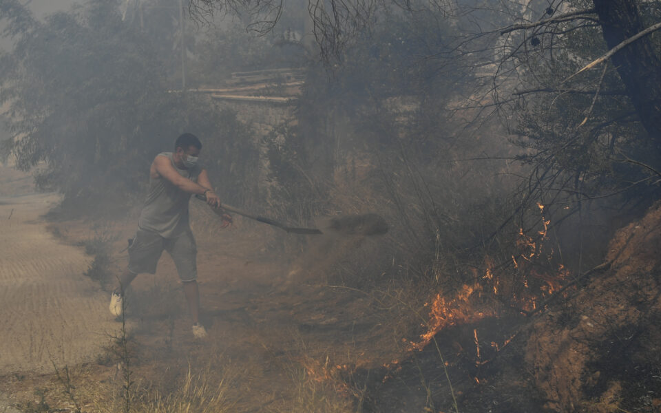 Wildfire rages out of control on the outskirts of Athens, reaches residential areas