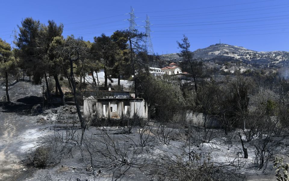 Crews battle scattered fires in Athens suburbs, helped by calmer winds and reinforcements