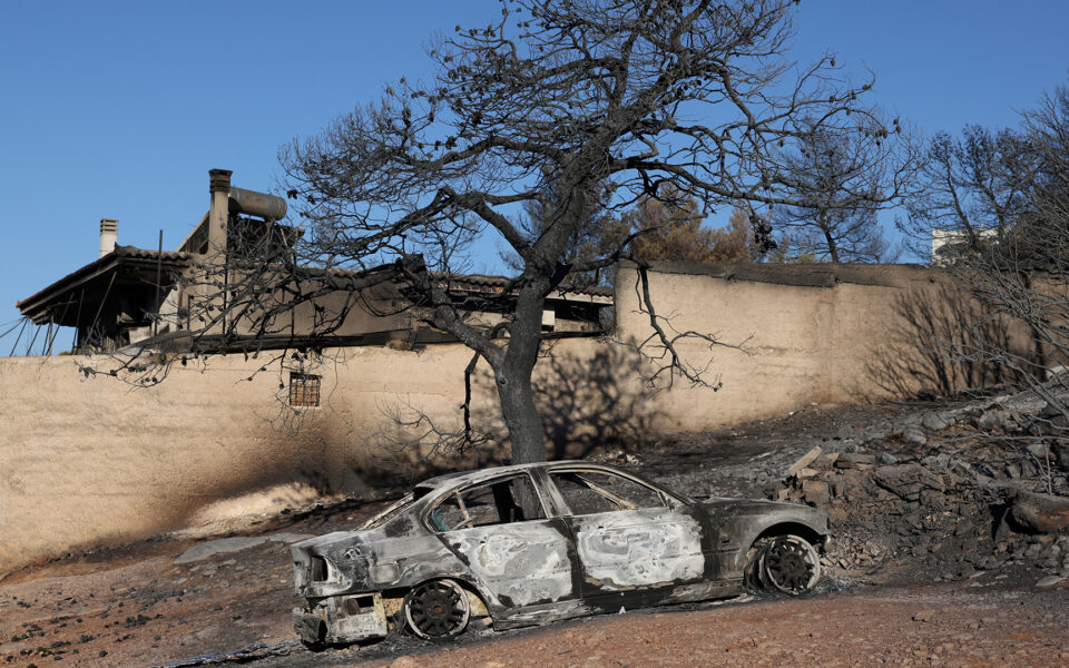 Crews battle scattered fires in Athens suburbs, helped by calmer winds, reinforcements