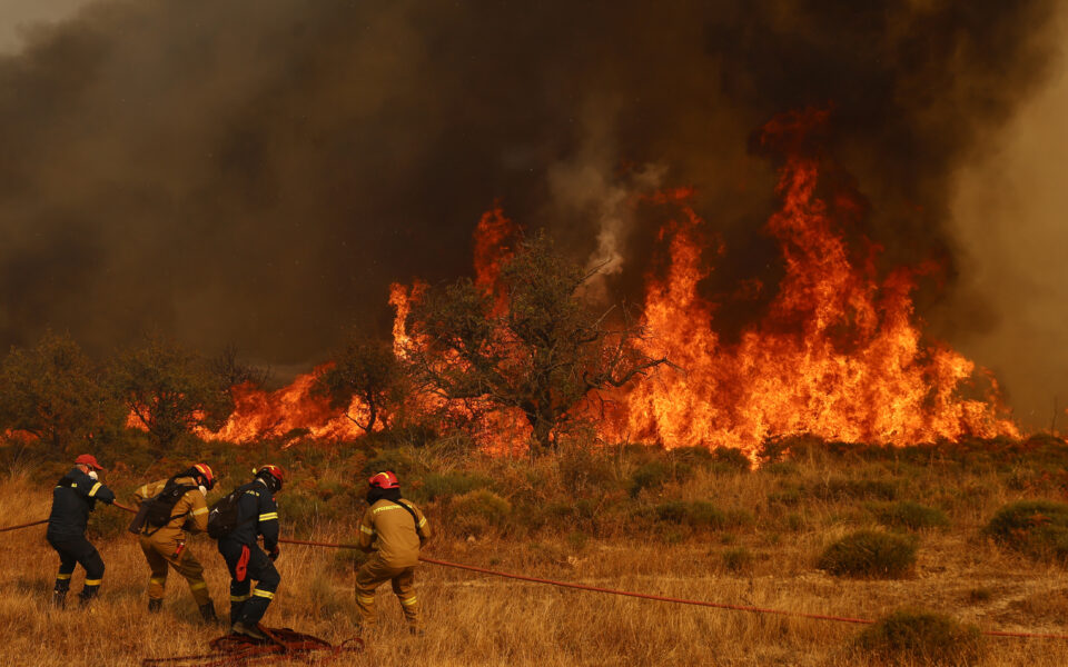 Hundreds of firefighters battle a deadly forest fire raging in southern Greece for the third day